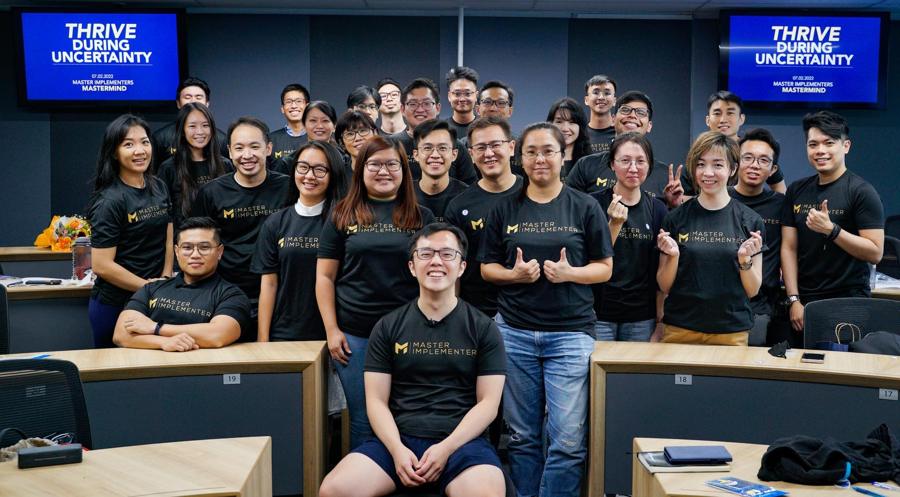 The Master Implementers mastermind cohort, Marc seated front and centre.