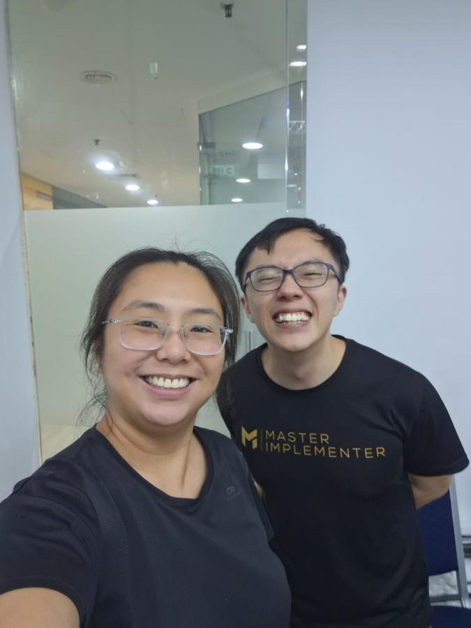 Marc and a client, both in MI tees.