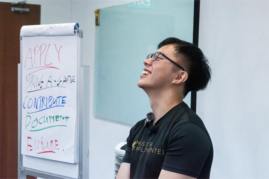 Marc laughing by the flip chart.