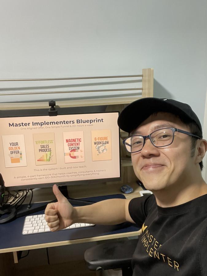 Marc at his desk with the Master Implementers Blueprint on screen.