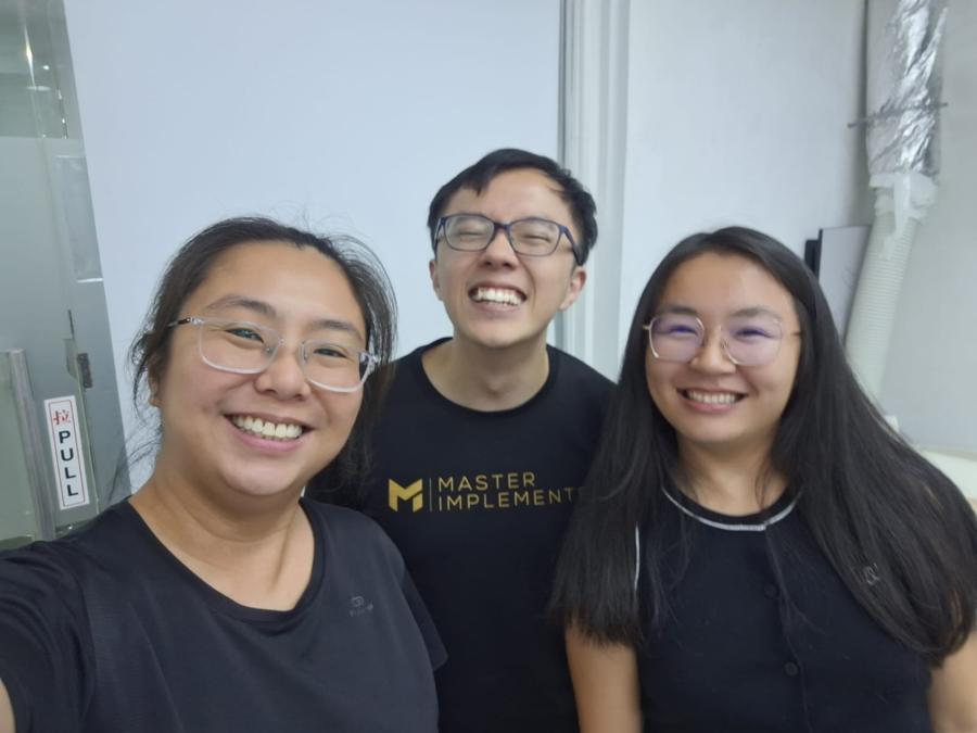 Marc with two clients, all in MI tees.