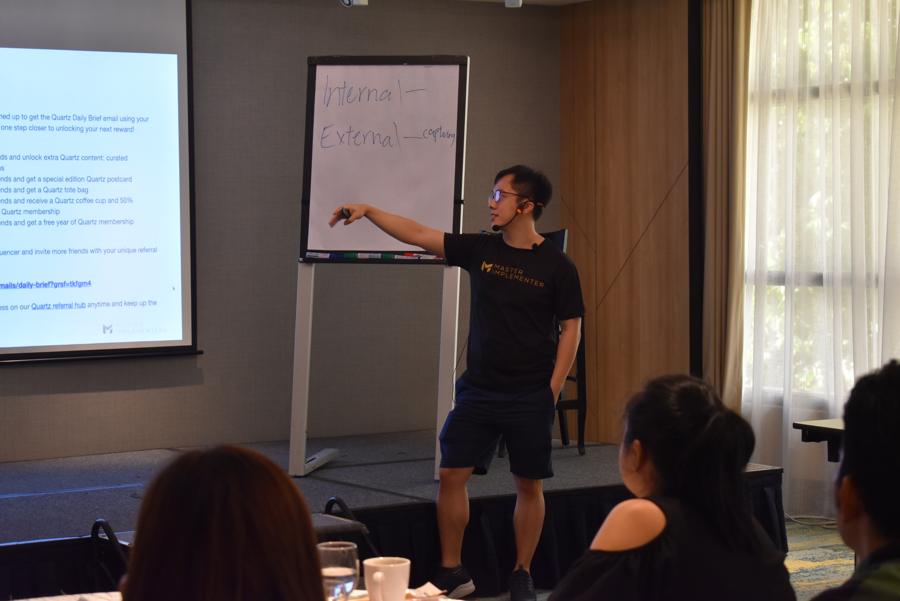 Marc at a flip chart with participants.