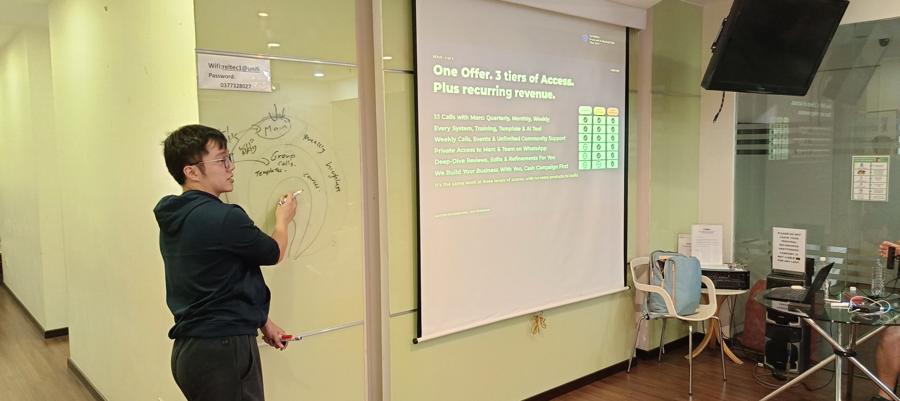 Marc at the whiteboard in Kuala Lumpur.